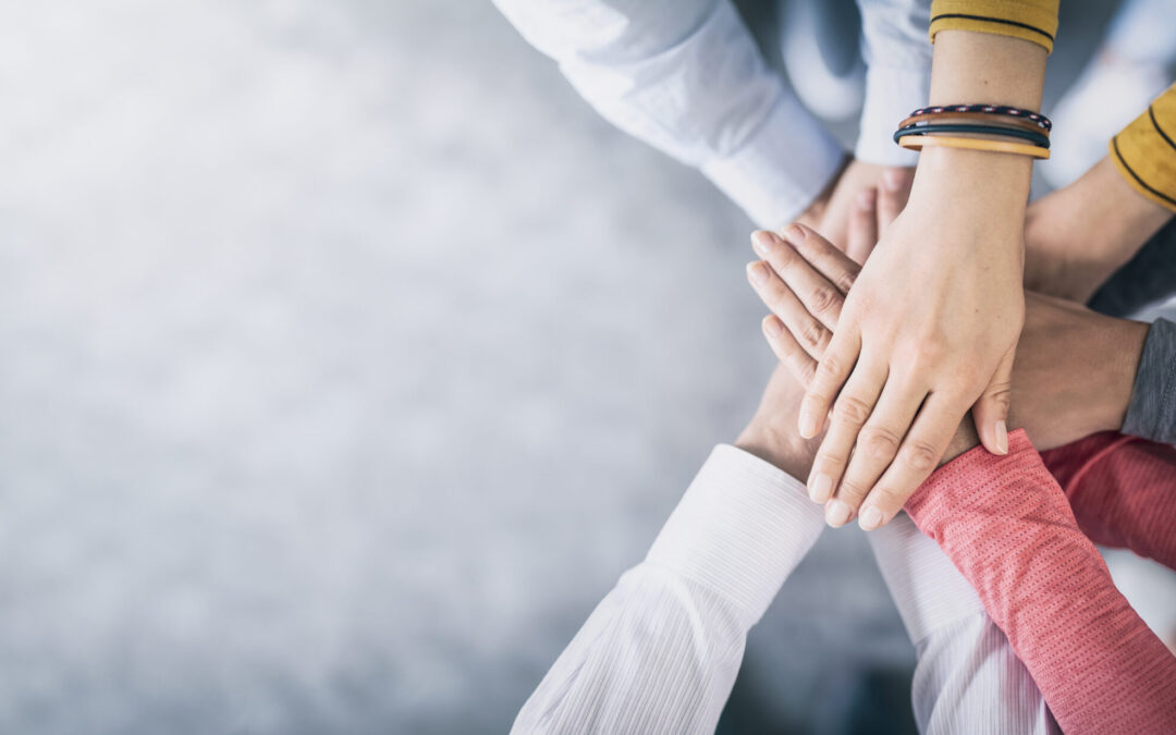 Close,Up,Top,View,Of,Young,Business,People,Putting,Their