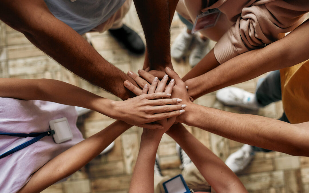 Top,View,Of,Diverse,Young,Volunteers,Putting,Their,Hands,On
